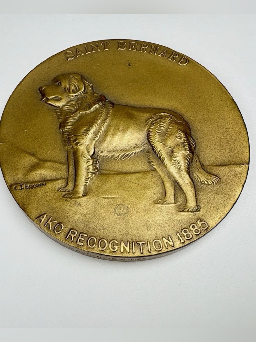 Bronze medal commemorating the AKC's recognition of the Saint Bernard in 1885.